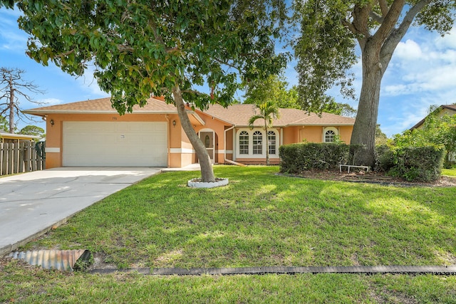 790 SE Ablett Ln, Port Saint Lucie, FL 34984 - ranch-style home featuring stucco siding, a garage, and driveway