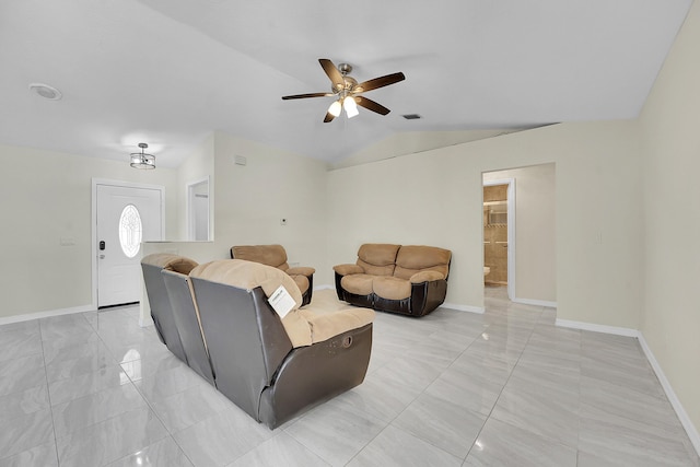 790 SE Ablett Ln, Port Saint Lucie, FL 34984 - living room featuring a ceiling fan, lofted ceiling, and light marble finish flooring