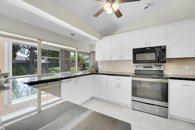 790 SE Ablett Ln, Port Saint Lucie, FL 34984 - kitchen with stainless steel appliances, plenty of natural light, lofted ceiling, and backsplash
