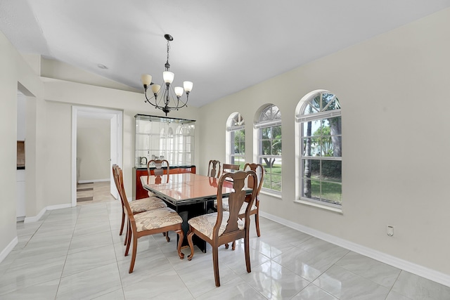 790 SE Ablett Ln, Port Saint Lucie, FL 34984 - dining space with a chandelier, lofted ceiling, and light tile patterned flooring