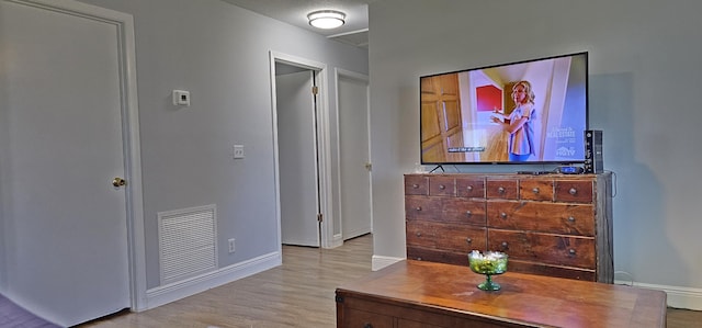 716 NW 16th St, Belle Glade, FL 33430 - corridor featuring wood finished floors and baseboards
