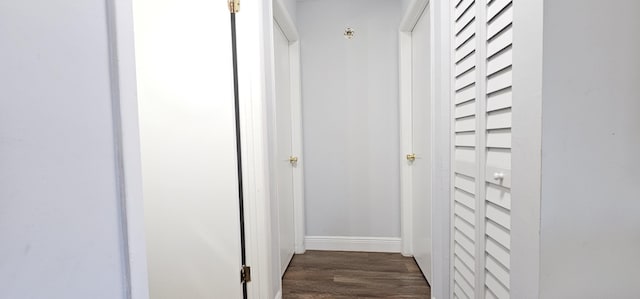 716 NW 16th St, Belle Glade, FL 33430 - hallway with dark wood-type flooring and baseboards
