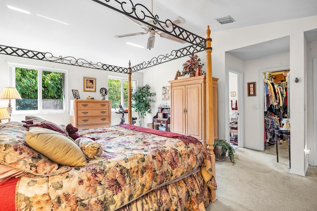 5404 E Pointe Villa Dr Unit 5406, Lighthouse Point, FL 33064 - bedroom with light carpet, a walk in closet, ceiling fan, and a closet