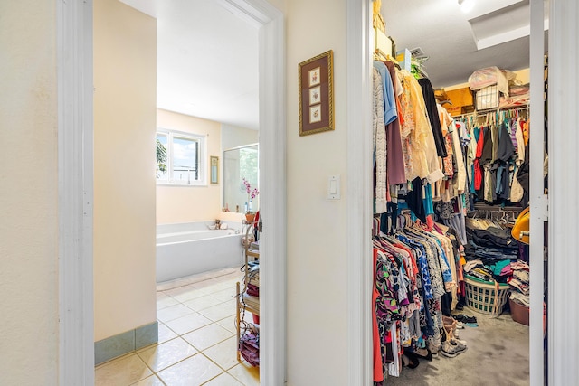 5404 E Pointe Villa Dr Unit 5406, Lighthouse Point, FL 33064 - walk in closet with tile patterned flooring