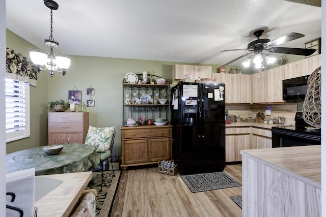 7626 Tahiti Ln Unit 104, Lake Worth, FL 33467 - kitchen featuring black appliances, ceiling fan, light wood finished floors, light countertops, and decorative light fixtures