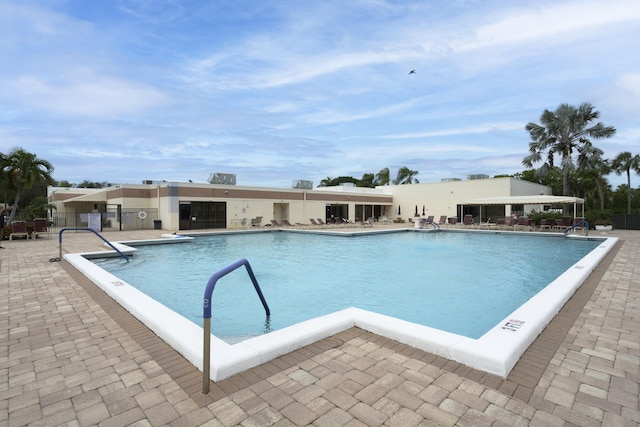 7626 Tahiti Ln Unit 104, Lake Worth, FL 33467 - community pool featuring a patio