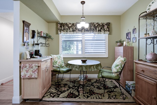 7626 Tahiti Ln Unit 104, Lake Worth, FL 33467 - dining space featuring wood finished floors and a chandelier