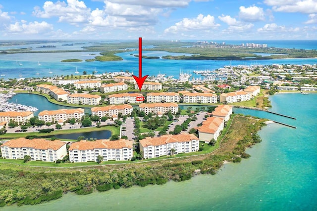 7 Harbour Isle Dr Unit 301, Fort Pierce, FL 34949 - drone / aerial view of a nearby body of water and apartment complex / building