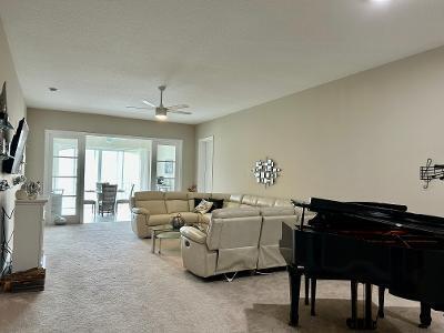 7 Harbour Isle Dr Unit 301, Fort Pierce, FL 34949 - carpeted living area with ceiling fan