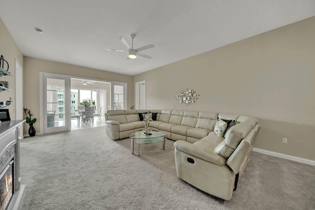 7 Harbour Isle Dr Unit 301, Fort Pierce, FL 34949 - living area with a ceiling fan, carpet floors, and a glass covered fireplace
