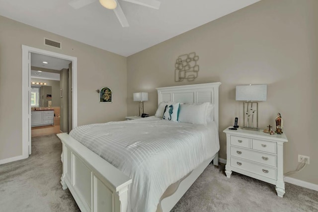 7 Harbour Isle Dr Unit 301, Fort Pierce, FL 34949 - bedroom featuring light carpet, ceiling fan, and ensuite bath