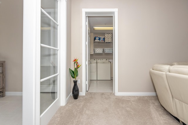 7 Harbour Isle Dr Unit 301, Fort Pierce, FL 34949 - hall with washer and dryer, tile patterned flooring, and carpet