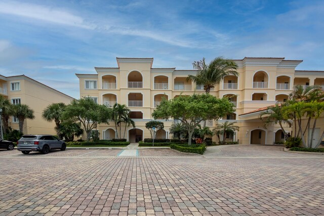 7 Harbour Isle Dr Unit 301, Fort Pierce, FL 34949 - view of building exterior with uncovered parking