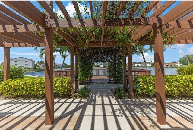 4444 NE Ocean Blvd Unit C2, Jensen Beach, FL 34957 - view of patio featuring a pergola and a water view
