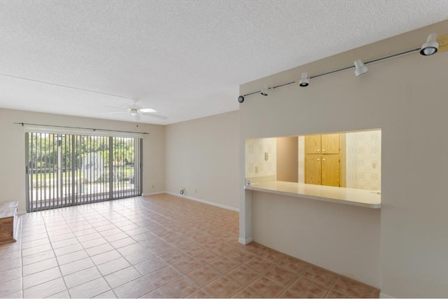 4444 NE Ocean Blvd Unit C2, Jensen Beach, FL 34957 - spare room with ceiling fan, a textured ceiling, and light tile patterned floors