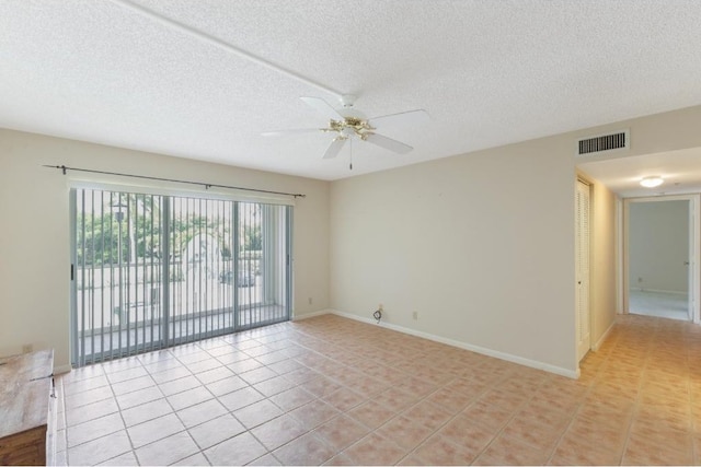 4444 NE Ocean Blvd Unit C2, Jensen Beach, FL 34957 - unfurnished room with a ceiling fan, light tile patterned floors, and a textured ceiling