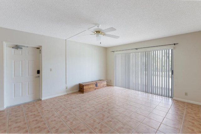 4444 NE Ocean Blvd Unit C2, Jensen Beach, FL 34957 - unfurnished room with a ceiling fan, light tile patterned floors, and a textured ceiling