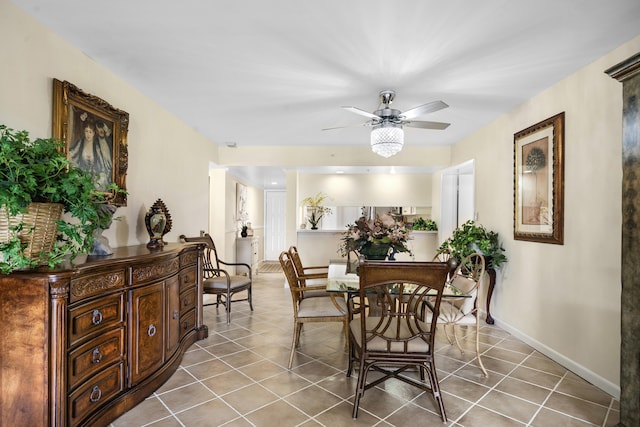 601 Seafarer Cir Unit 104, Jupiter, FL 33477 - tiled dining room with a ceiling fan and baseboards