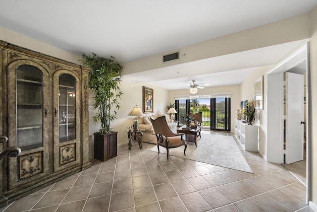 601 Seafarer Cir Unit 104, Jupiter, FL 33477 - living area featuring tile patterned floors and ceiling fan