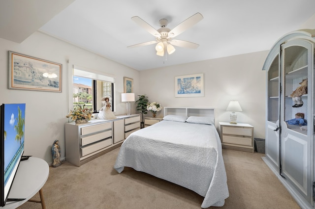 601 Seafarer Cir Unit 104, Jupiter, FL 33477 - bedroom with light carpet and ceiling fan