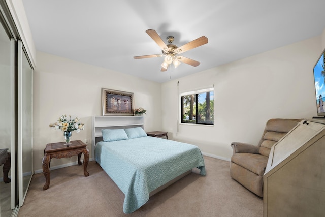 601 Seafarer Cir Unit 104, Jupiter, FL 33477 - bedroom with light carpet, a closet, and ceiling fan