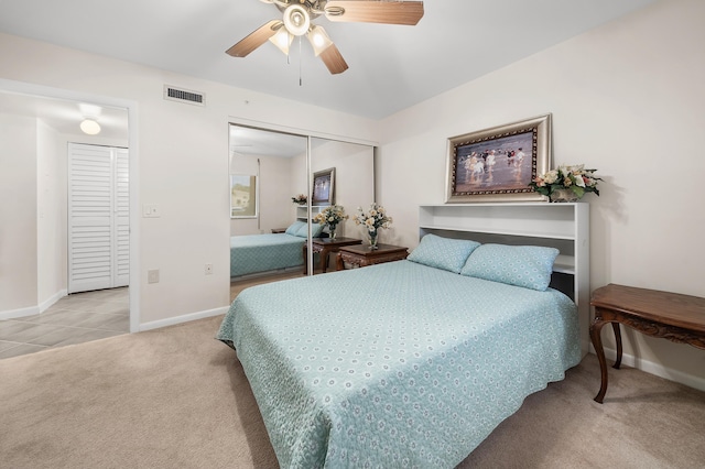 601 Seafarer Cir Unit 104, Jupiter, FL 33477 - carpeted bedroom featuring a ceiling fan, a closet, and tile patterned flooring
