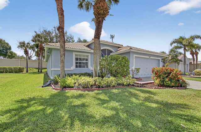 8182 Duomo Cir, Boynton Beach, FL 33472 - mediterranean / spanish-style house with an attached garage, a front yard, stucco siding, and a tile roof