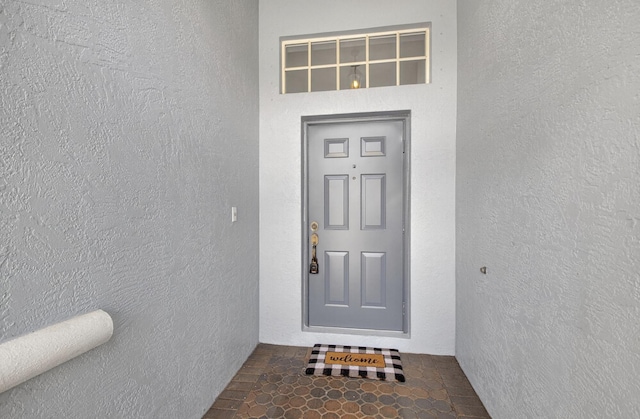 8182 Duomo Cir, Boynton Beach, FL 33472 - doorway to property with stucco siding