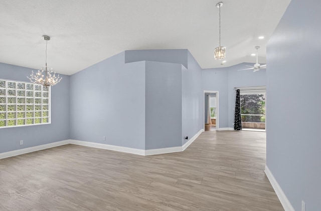 8182 Duomo Cir, Boynton Beach, FL 33472 - spare room featuring a chandelier, healthy amount of natural light, a ceiling fan, vaulted ceiling, and recessed lighting