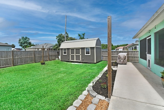 1037 SW Romaine Ln, Port Saint Lucie, FL 34953 - fenced backyard with a storage unit and a patio