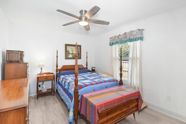 1037 SW Romaine Ln, Port Saint Lucie, FL 34953 - bedroom featuring light wood finished floors and a ceiling fan