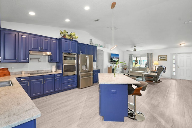 1037 SW Romaine Ln, Port Saint Lucie, FL 34953 - kitchen featuring stainless steel appliances, lofted ceiling, a kitchen bar, a ceiling fan, and a kitchen island
