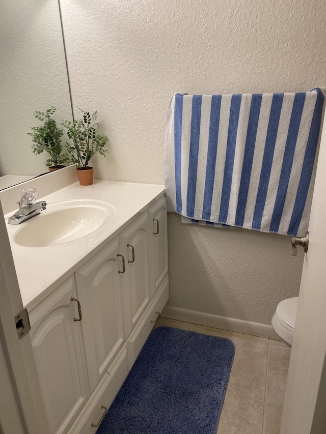 341 Pine Ridge Cir Unit D1, Greenacres, FL 33463 - bathroom with a textured wall, vanity, and tile patterned floors