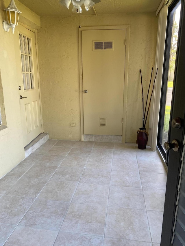 341 Pine Ridge Cir Unit D1, Greenacres, FL 33463 - doorway to property with stucco siding and a patio