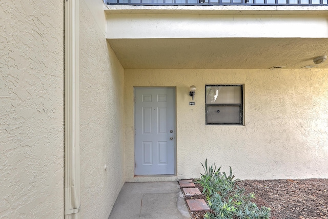 6545 SE Federal Hwy Unit 102, Stuart, FL 34997 - property entrance featuring stucco siding