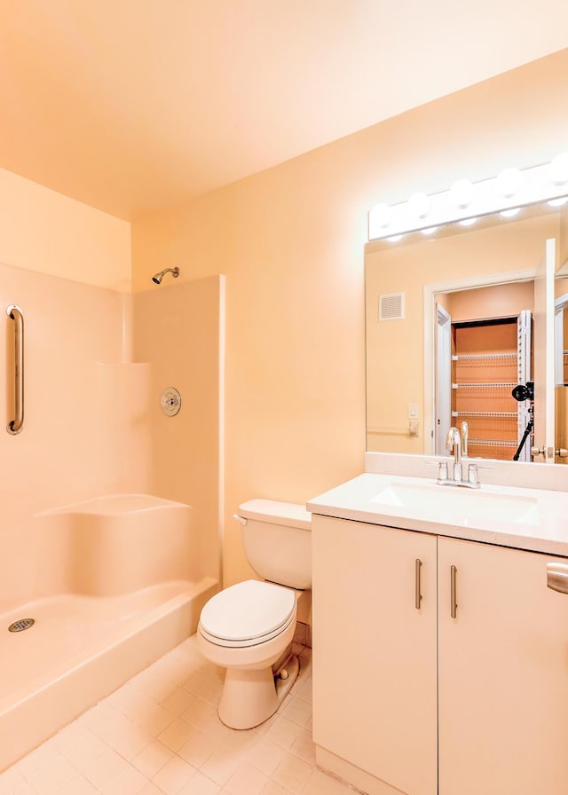 6545 SE Federal Hwy Unit 102, Stuart, FL 34997 - bathroom with vanity, tile patterned flooring, and a shower