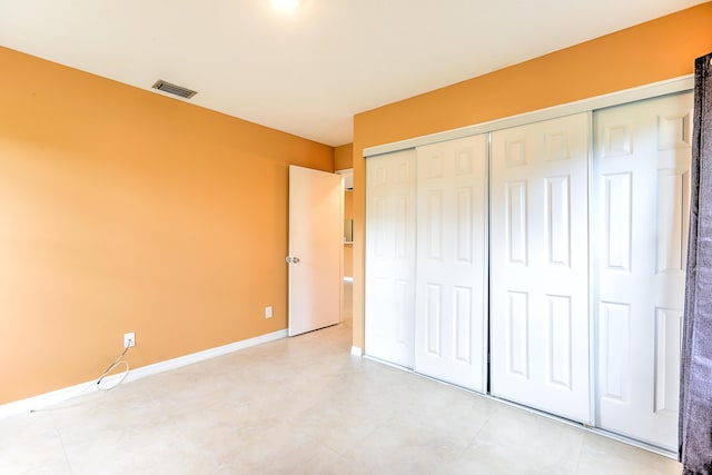 6545 SE Federal Hwy Unit 102, Stuart, FL 34997 - unfurnished bedroom with a closet and baseboards