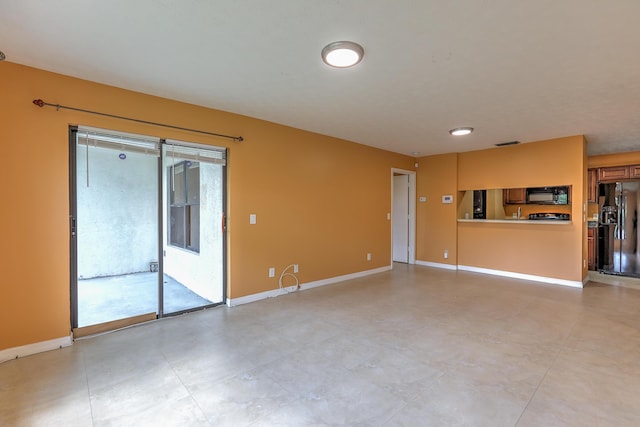 6545 SE Federal Hwy Unit 102, Stuart, FL 34997 - unfurnished living room with baseboards