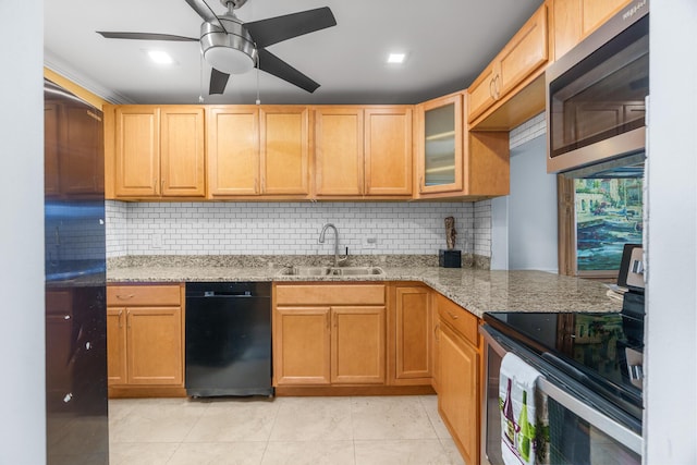 5961 NW 61st Ave Unit 203, Tamarac, FL 33319 - kitchen with stainless steel appliances, light stone countertops, ceiling fan, and backsplash