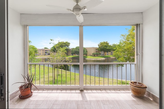 5961 NW 61st Ave Unit 203, Tamarac, FL 33319 - unfurnished sunroom featuring a water view