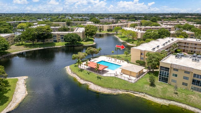 5961 NW 61st Ave Unit 203, Tamarac, FL 33319 - drone / aerial view of a pool and a large body of water