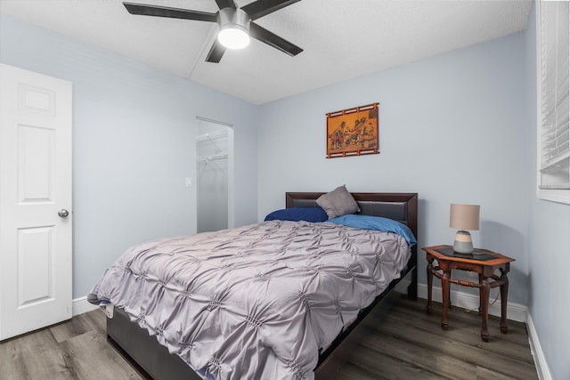 5961 NW 61st Ave Unit 203, Tamarac, FL 33319 - bedroom with wood finished floors, ceiling fan, and a closet