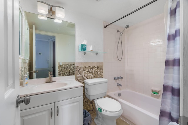 5961 NW 61st Ave Unit 203, Tamarac, FL 33319 - bathroom featuring tile walls, shower / bath combo with shower curtain, vanity, and a wainscoted wall
