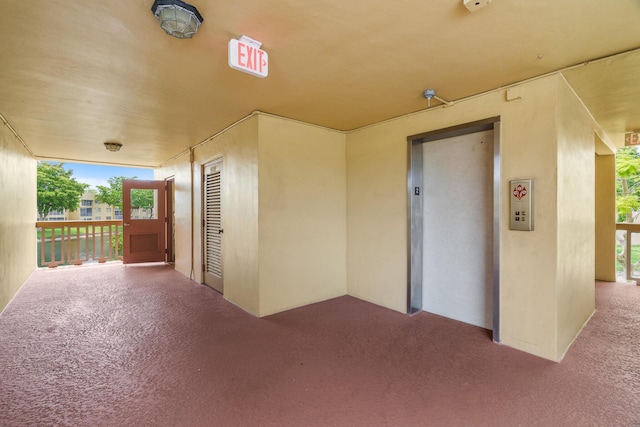 5961 NW 61st Ave Unit 203, Tamarac, FL 33319 - view of patio featuring elevator