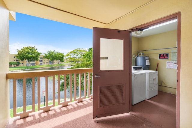 5961 NW 61st Ave Unit 203, Tamarac, FL 33319 - balcony with washer and clothes dryer, electric water heater, and a water view