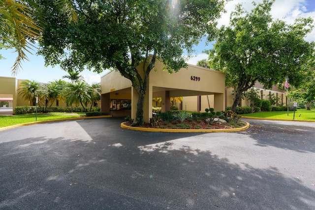 5961 NW 61st Ave Unit 203, Tamarac, FL 33319 - view of front facade featuring stucco siding