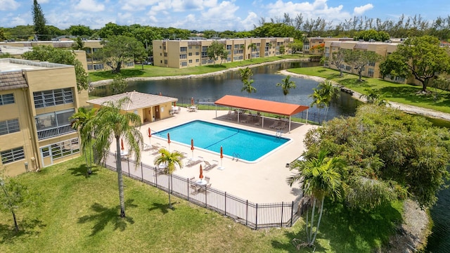5961 NW 61st Ave Unit 203, Tamarac, FL 33319 - community pool featuring a water view and a patio