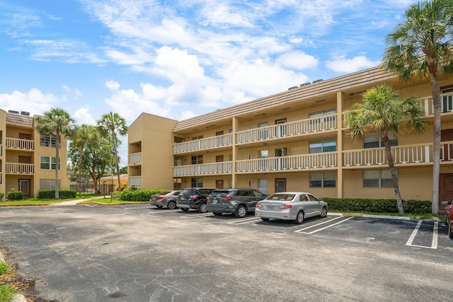 5961 NW 61st Ave Unit 203, Tamarac, FL 33319 - view of apartment building / complex with uncovered parking