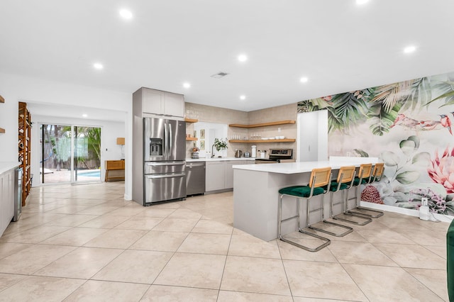 29 SE 8th Ave, Deerfield Beach, FL 33441 - kitchen with appliances with stainless steel finishes, open shelves, gray cabinets, light countertops, and recessed lighting