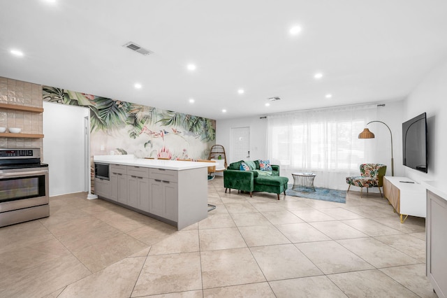 29 SE 8th Ave, Deerfield Beach, FL 33441 - kitchen featuring appliances with stainless steel finishes, gray cabinetry, light countertops, recessed lighting, and light tile patterned floors